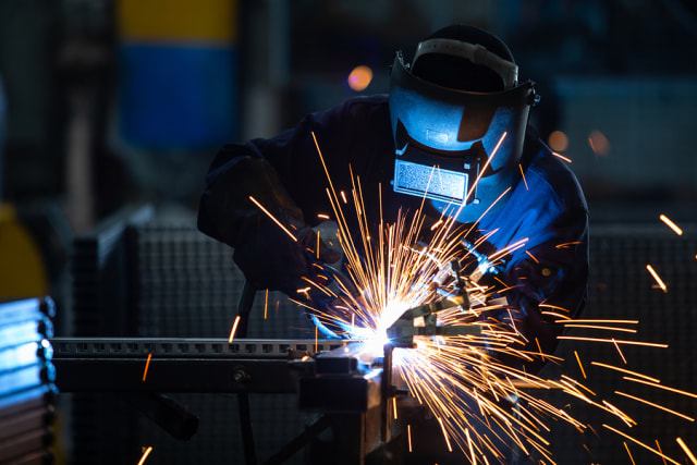 bigstock-Workers-Wearing-Industrial